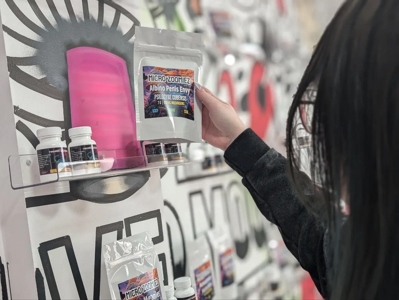 Female Buying Products Inside Microzoomiez, Preston St Store showing Mushroom products